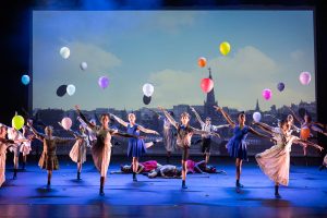 Dancers on stage with balloons at National Youth Ballet performance of Echoes of Tomorrow